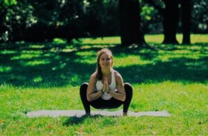 Eszter practising a grounding yoga pose on Gellért Hill.