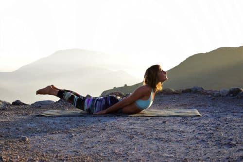 Locust yoga pose practised on top of a mountain in Spain.