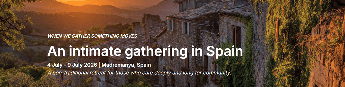 Image of a Spain sunset with golden light over a medieval town advertising a Spain yoga retreat.