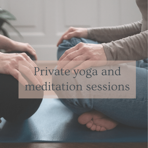 Two pesons sitting on the floor in a meditation position in Budapest.